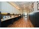 Hallway showcasing wood floors, custom trim, and built-in cabinets for storage and stylish display at 705 Springer Mountain Dr, Canton, GA 30114
