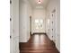 Spacious hallway featuring beautiful wood floors and elegant white wainscoting at 705 Springer Mountain Dr, Canton, GA 30114