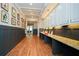 Hallway showcasing wood floors, custom trim, and built-in cabinets for storage and stylish display at 705 Springer Mountain Dr, Canton, GA 30114