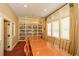 A warm and inviting library with an expansive book collection for peaceful reading at 705 Springer Mountain Dr, Canton, GA 30114