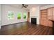 Sunlit living room with built-in storage and view of a treed yard area for natural light throughout the home at 705 Springer Mountain Dr, Canton, GA 30114