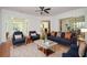 Cozy living room with hardwood floors, ceiling fan, and decorative rug for added comfort at 705 Springer Mountain Dr, Canton, GA 30114