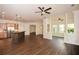 Open living space featuring a kitchen with an island bar, stainless appliances, and a nearby sitting area at 705 Springer Mountain Dr, Canton, GA 30114