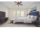 Modern main bedroom with carpet, plantation shutters, tray ceilings and a dark blue headboard at 705 Springer Mountain Dr, Canton, GA 30114