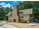 Pool house with a stone fireplace, cornhole boards, and space to sit around the pool at 705 Springer Mountain Dr, Canton, GA 30114