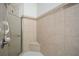 Modern glass-enclosed shower with tile walls and corner seat at 705 Springer Mountain Dr, Canton, GA 30114