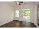 Bright sun room with sliding glass doors to the patio and a large window to the side yard at 705 Springer Mountain Dr, Canton, GA 30114