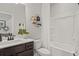 Main bathroom with tub shower, vanity, and modern fixtures at 4493 Eastbrook Pl, Snellville, GA 30039