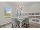 Bright dining area with granite table, chairs, and large window at 4493 Eastbrook Pl, Snellville, GA 30039