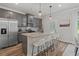 Modern kitchen with gray cabinets, granite counters, and stainless steel appliances at 4493 Eastbrook Pl, Snellville, GA 30039