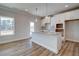 Modern kitchen with white cabinets, granite countertops and island at 4493 Eastbrook Pl, Snellville, GA 30039