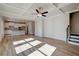 Open concept living room with hardwood floors and kitchen views at 4493 Eastbrook Pl, Snellville, GA 30039