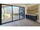 Dining area with sliding glass doors to deck and built-in cabinetry at 165 Cedarwood Ln, Roswell, GA 30075