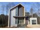 Modern two-story home with metal siding and attached garage at 165 Cedarwood Ln, Roswell, GA 30075