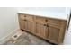 Laundry room with light wood cabinets and white countertop at 165 Cedarwood Ln, Roswell, GA 30075