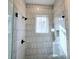 Large shower with subway tile and frameless glass enclosure at 165 Cedarwood Ln, Roswell, GA 30075