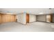 Finished basement with neutral walls, carpeting, and multiple rooms at 1720 Mineral Springs Rd, Hoschton, GA 30548