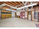 Unfinished garage with workbench and storage cabinets at 1720 Mineral Springs Rd, Hoschton, GA 30548