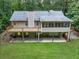 Aerial view of house exterior, deck, and screened porch at 1720 Mineral Springs Rd, Hoschton, GA 30548