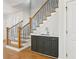 Staircase features a butler's pantry with a granite countertop and modern finishes at 102 Cottage Gate Ln, Roswell, GA 30076