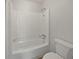Bathroom features a bathtub with shower and a toilet, all in a clean and functional layout at 1084 Village Main St, Stone Mountain, GA 30088