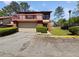 Inviting two-story home with a balcony, garage, and well-maintained landscaping at 1084 Village Main St, Stone Mountain, GA 30088
