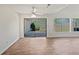 Living room with a sliding glass door providing access to the backyard and natural light at 1084 Village Main St, Stone Mountain, GA 30088