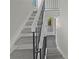 View of the staircase with white risers and black railing leading to the upper level at 1084 Village Main St, Stone Mountain, GA 30088