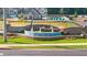 Inverness at Sugarloaf community entrance with a tiered water feature and a view of the community pool at 318 Elgin Dr, Lawrenceville, GA 30045