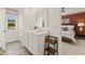 Bathroom features a dual sink vanity, a large mirror, and access to the main bedroom at 338 Elgin Dr, Lawrenceville, GA 30045