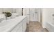 Bright bathroom featuring double sinks, a modern vanity, and a glass-enclosed shower at 338 Elgin Dr, Lawrenceville, GA 30045