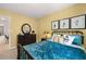 Bedroom with yellow walls, furniture and decor with a glimpse into another room at 338 Elgin Dr, Lawrenceville, GA 30045