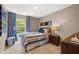 Bedroom with blue patterned curtains and bright window with a view of nature at 338 Elgin Dr, Lawrenceville, GA 30045