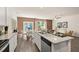 Spacious kitchen with white cabinets and a large island with barstool seating at 338 Elgin Dr, Lawrenceville, GA 30045