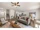 Open living space featuring a cozy living room, stairs, and a modern kitchen at 338 Elgin Dr, Lawrenceville, GA 30045