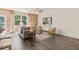 Well-lit living area with comfortable seating, decorative rug, and views of the outdoors at 338 Elgin Dr, Lawrenceville, GA 30045