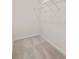 Empty walk-in closet features carpeted floors and a wire shelving unit at 338 Elgin Dr, Lawrenceville, GA 30045