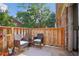 Private deck with wooden fence and seating area at 5558 Kingsport Dr # 27, Atlanta, GA 30342