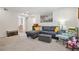 Cozy living room featuring a sectional sofa, comfy chairs, and large artwork at 5558 Kingsport Dr # 27, Atlanta, GA 30342