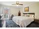 Spacious main bedroom with king-size bed and ceiling fan at 5558 Kingsport Dr # 27, Atlanta, GA 30342