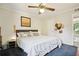 Spacious main bedroom with king-size bed and ceiling fan at 5558 Kingsport Dr # 27, Atlanta, GA 30342