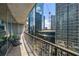 Outdoor balcony with city views and seating for two at 1080 Peachtree Ne St # 1309, Atlanta, GA 30309