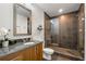 Modern bathroom with a large shower and granite vanity at 1080 Peachtree Ne St # 1309, Atlanta, GA 30309