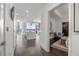 Modern hallway with hardwood floors and access to bedroom and kitchen at 1080 Peachtree Ne St # 1309, Atlanta, GA 30309