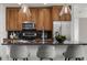 Sleek kitchen, featuring stainless steel appliances and wood cabinetry at 1080 Peachtree Ne St # 1309, Atlanta, GA 30309