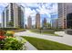 Landscaped patio with walkway and city views at 1080 Peachtree Ne St # 1309, Atlanta, GA 30309