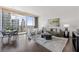 Modern living room with city views, hardwood floors, and stylish furniture at 1080 Peachtree Ne St # 1309, Atlanta, GA 30309