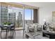 Spacious living area featuring floor-to-ceiling windows and city views at 1080 Peachtree Ne St # 1309, Atlanta, GA 30309