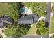 Aerial view showcases the property's expansive lot, mature trees, private pool, and prime neighborhood location at 1357 Baniff Ct, Snellville, GA 30078