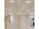 Finished basement area with coffered ceiling, recessed lighting, and stairway access at 1357 Baniff Ct, Snellville, GA 30078